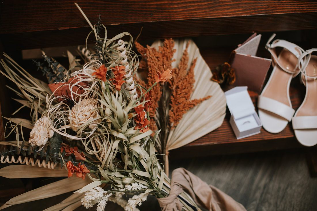 Bride laughing with her groom during their intimate cabin elopement