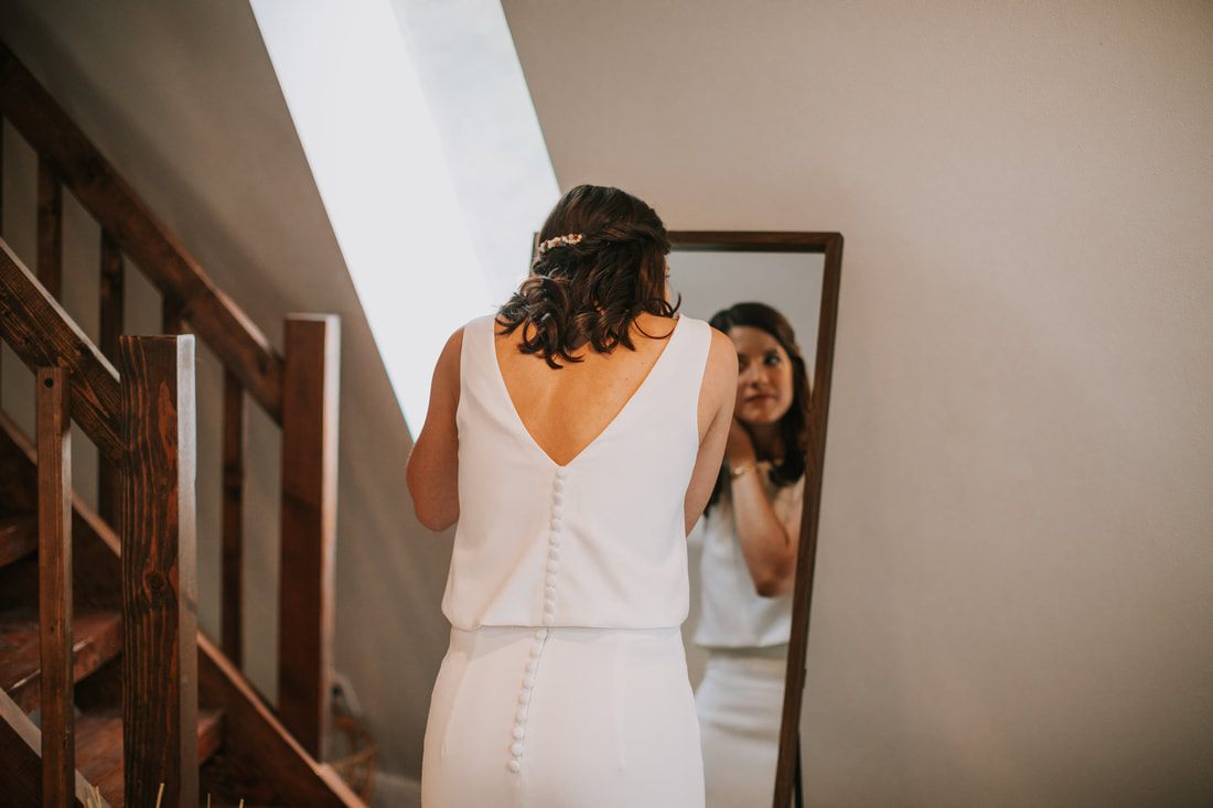 Bride's wedding details styled near the water at the PNW cabin