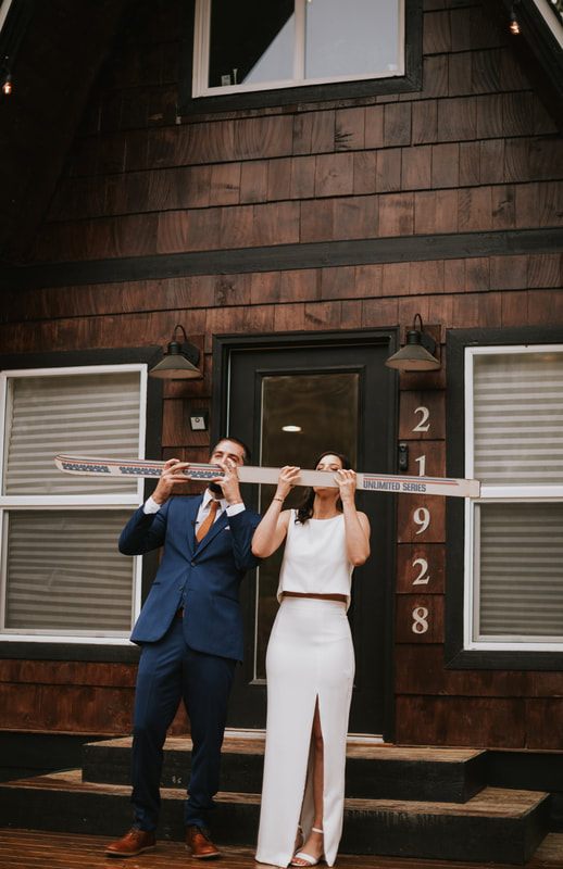 Bride laughing with her groom during their intimate cabin elopement