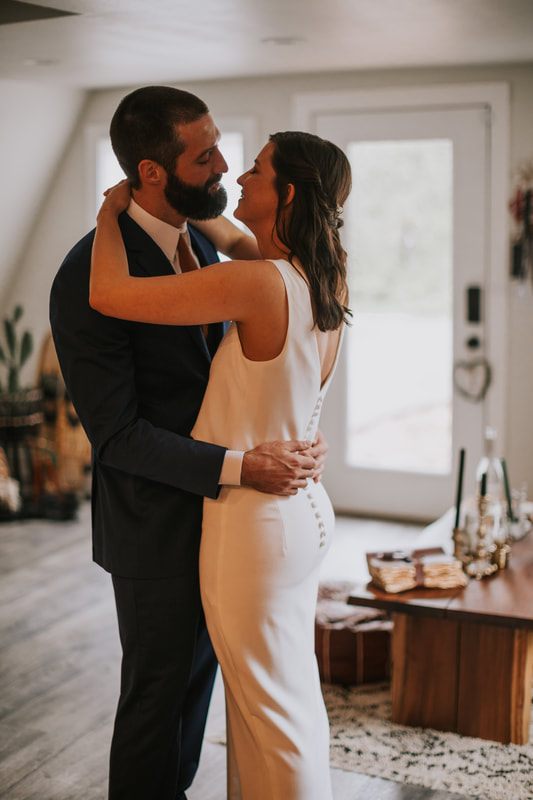 Intimate portrait of the newlyweds against the Cascade Mountains backdrop