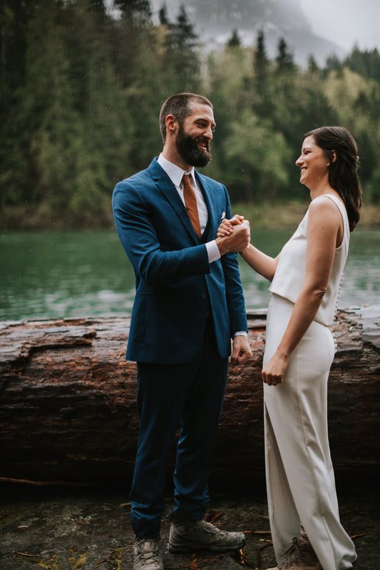 Close-up of the couple's clasped hands during their vows