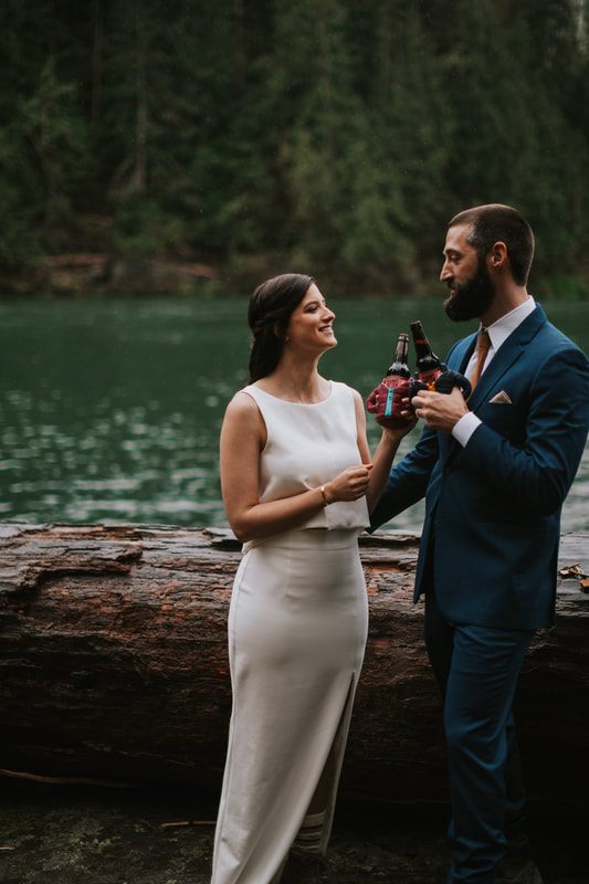 Elopement couple embracing near the mountains at That PNW Cabin