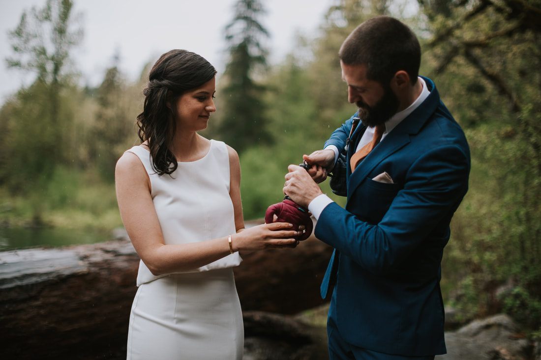 Bride laughing with her groom during their intimate cabin elopement
