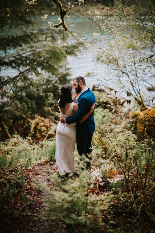 Intimate portrait of the newlyweds against the Cascade Mountains backdrop