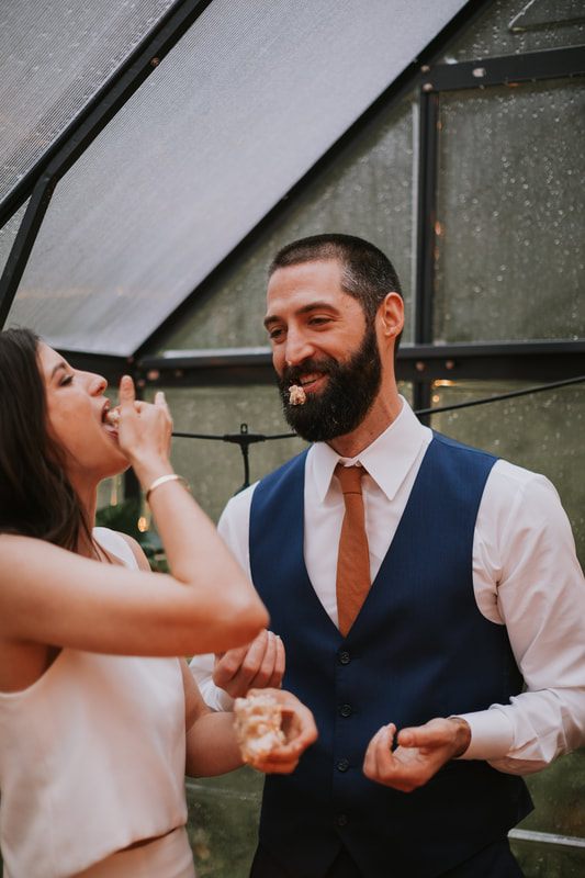 Close-up of the couple's clasped hands during their vows