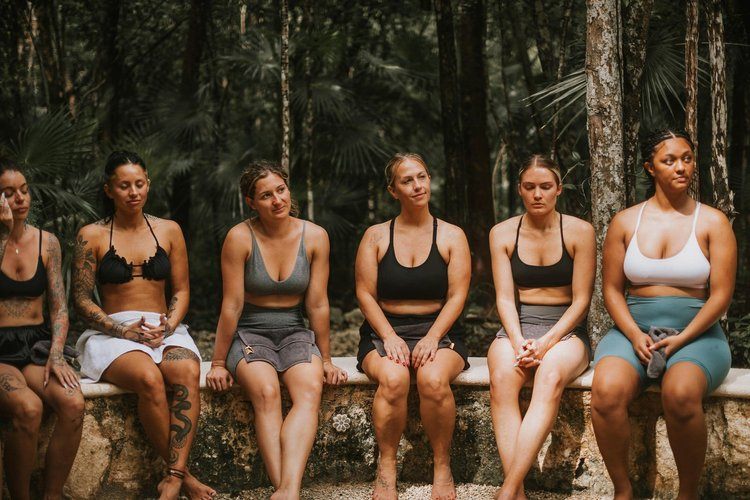 Women gathered at sunset on the Tulum women's retreat