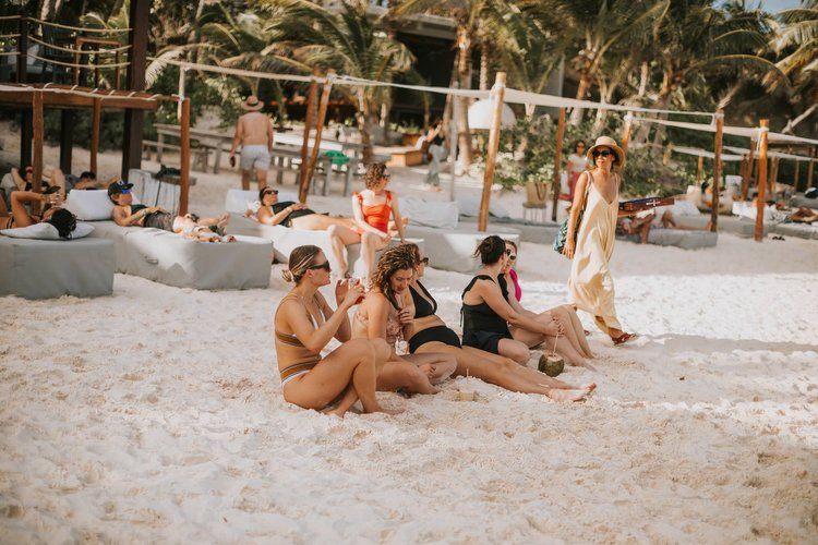 Women gathered at sunset on the Tulum women's retreat