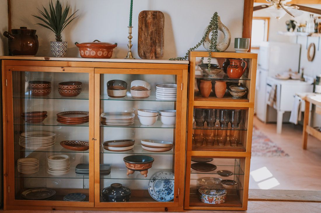 Close-up of studio tools and creative supplies at the desert property