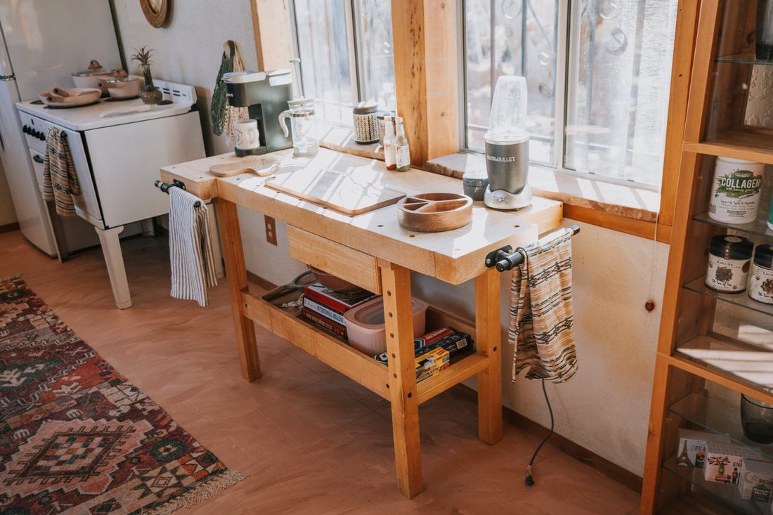 Sunlit desert house kitchen in Joshua Tree, California, the kind of home base a women's adventure retreat runs from