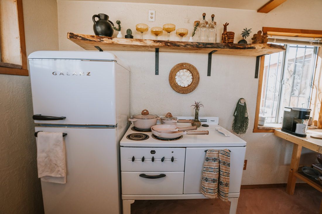 Pottery wheel and kiln setup in the artist studio space