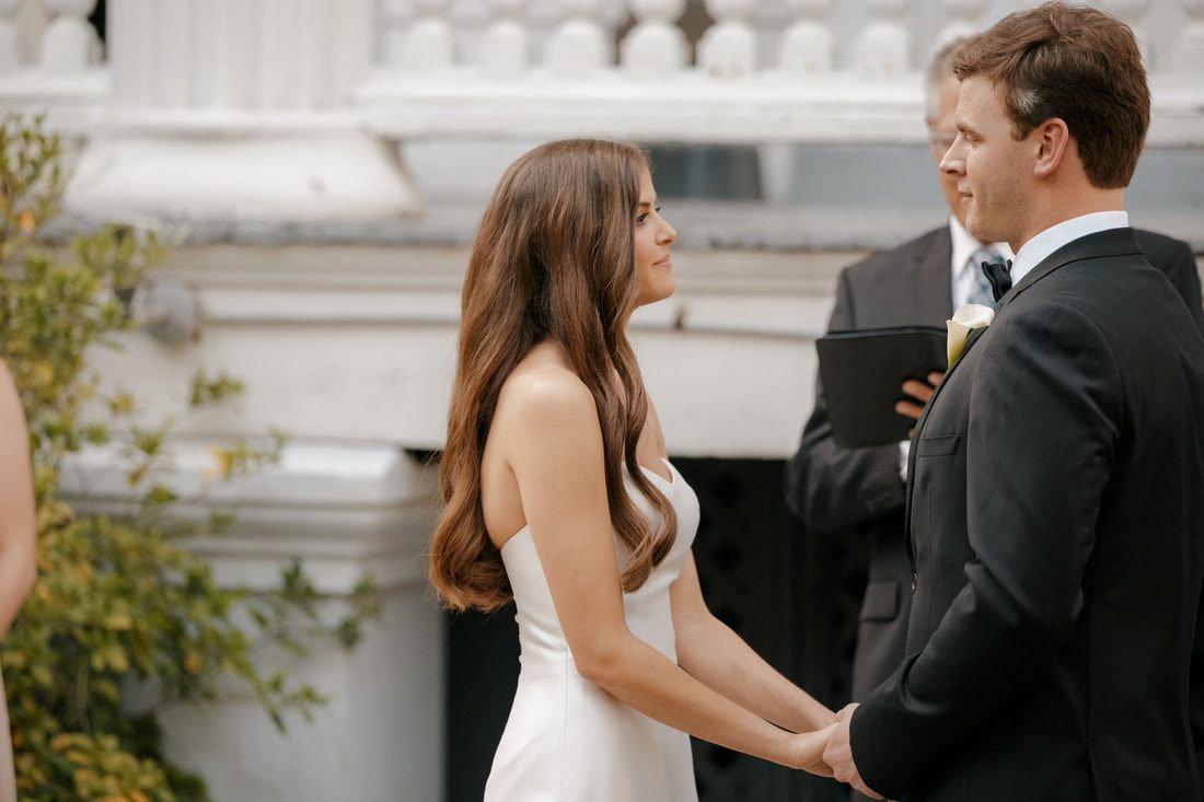 Wedding ceremony moment as Tyler and Emily exchange vows in Charleston