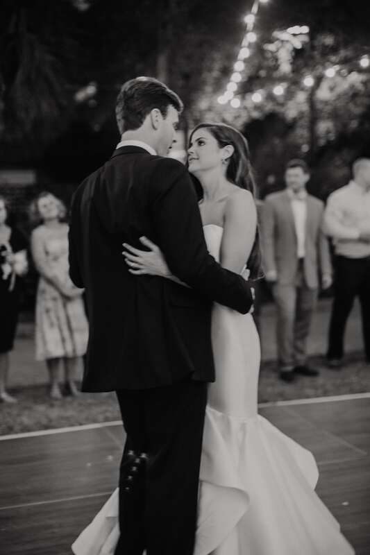 Guests celebrating and toasting the newlyweds in downtown Charleston