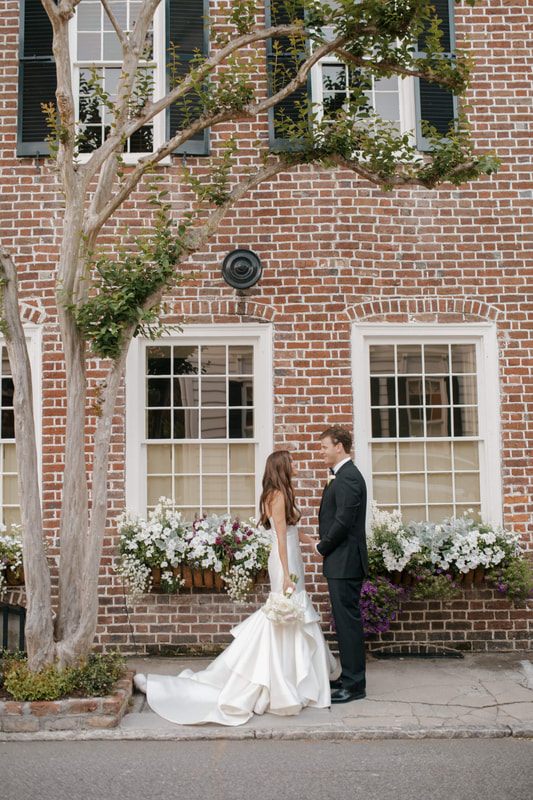 Tyler and Emily sharing a first look moment on their Charleston wedding day