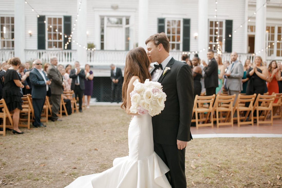 Detail shot of the wedding rings and bouquet at the Charleston venue
