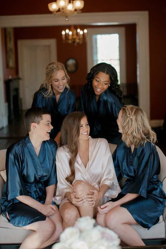 Bride getting ready with her bridesmaids before the Charleston wedding