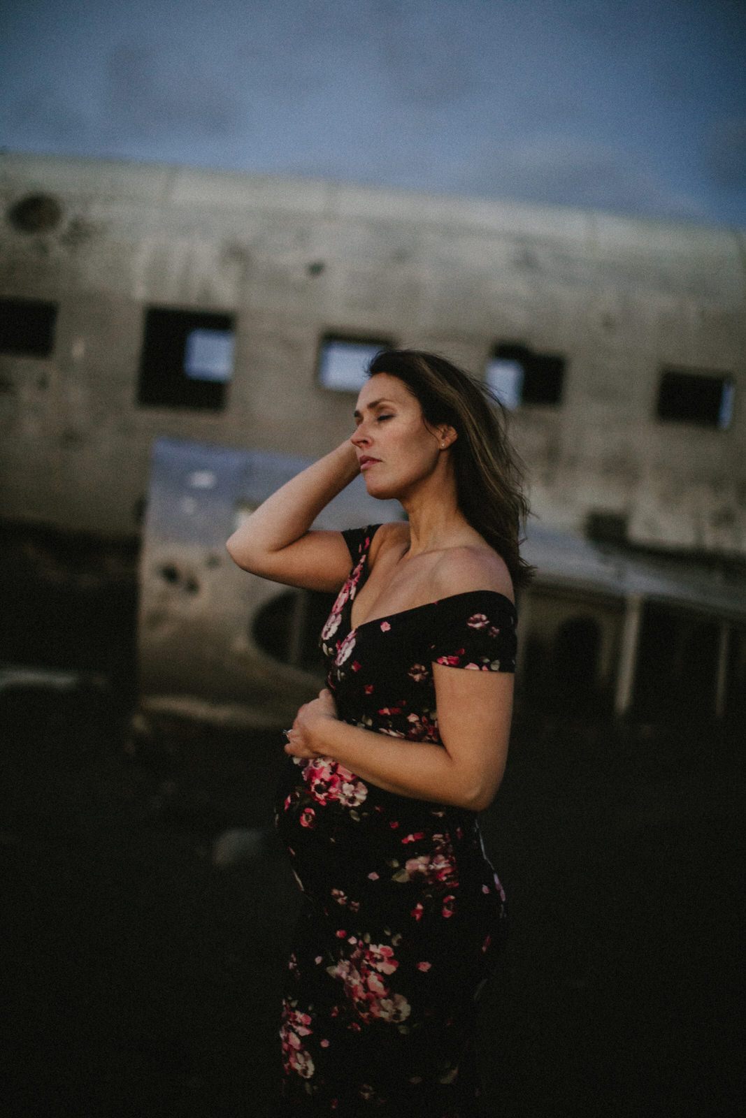 Expecting mother posed inside the abandoned plane fuselage in Iceland