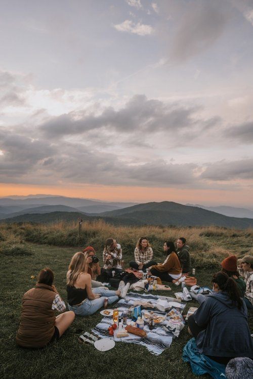 Women gathered at a downtown Asheville brewery after a hike