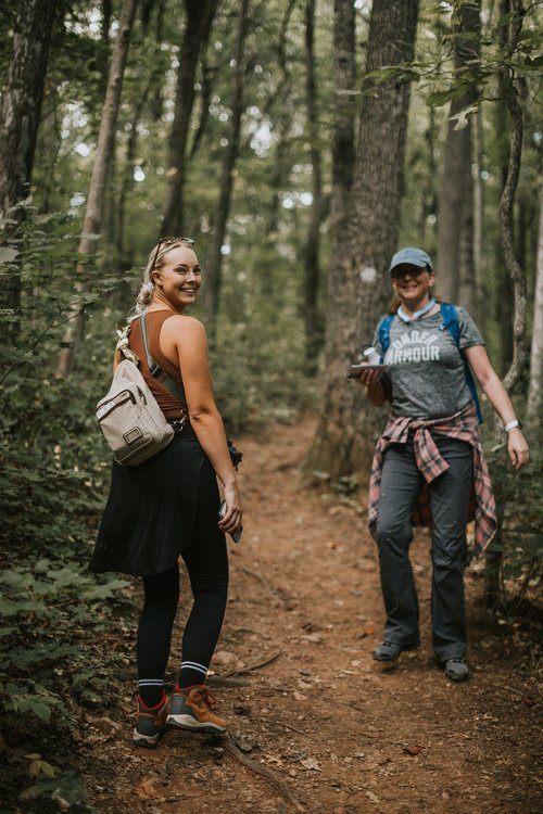 Women gathered at a downtown Asheville brewery after a hike