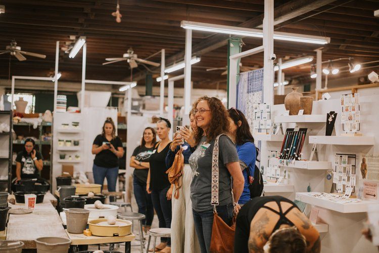 Women gathered at a downtown Asheville brewery after a hike
