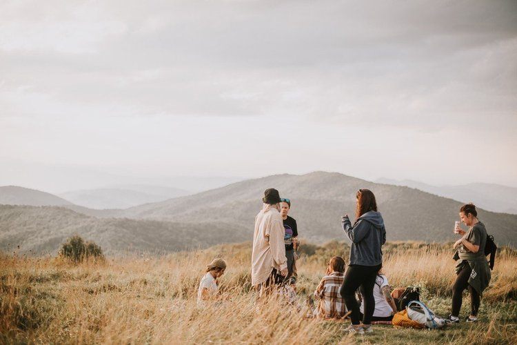 Sunset picnic at Max Patch on an Asheville women's retreat