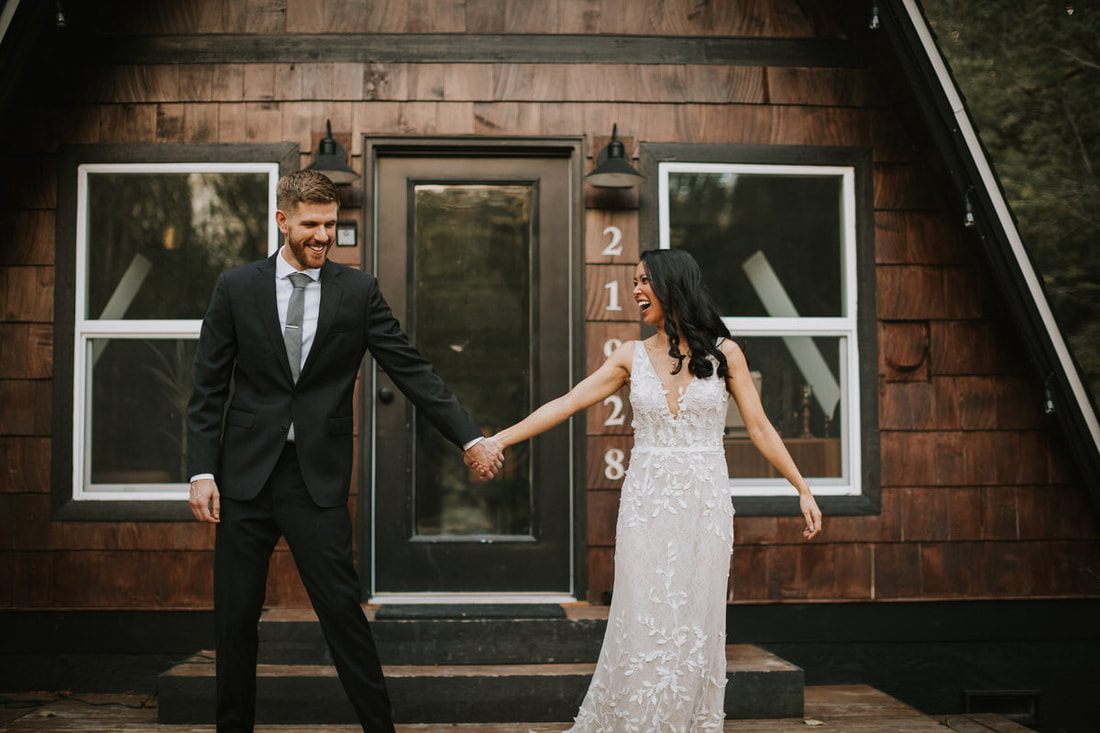 Bride and groom laughing together in the Cascade Mountains
