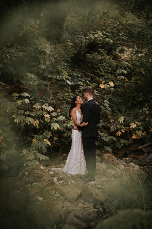 Couple hiking a forest trail near Lake Serene after their wedding