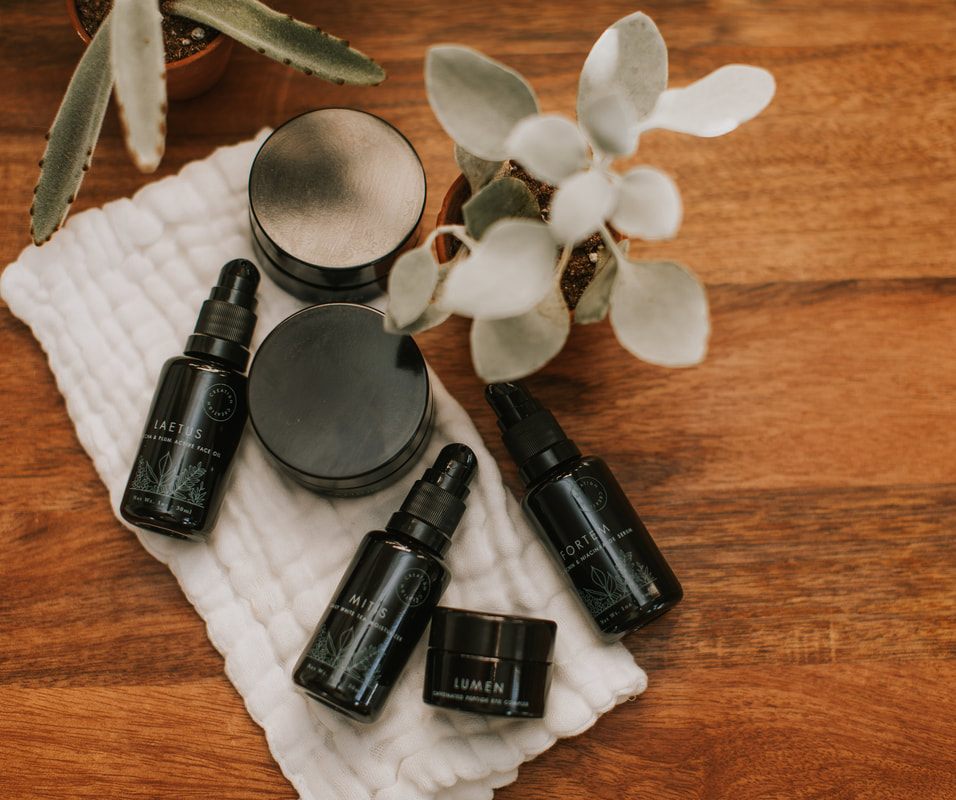 Botanical skincare bottle styled for Creation Skin Sanctuary product photography.