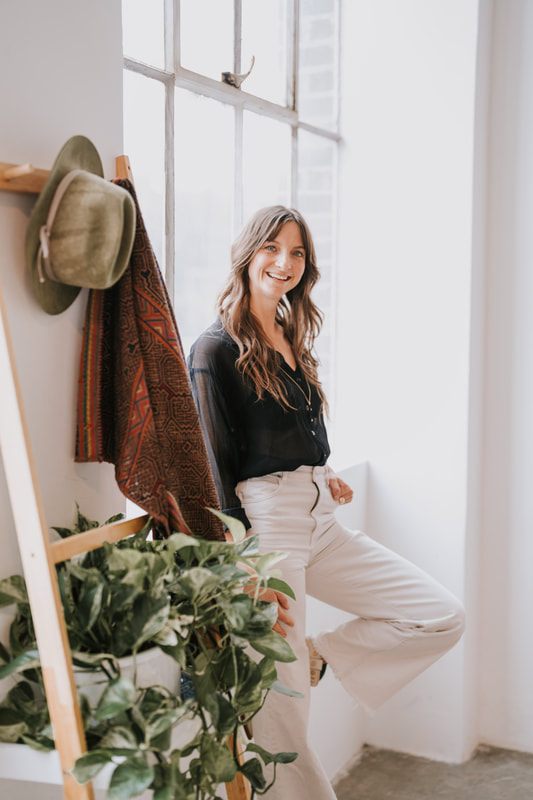 Close-up branding portrait of Celeste smiling warmly during her Seattle studio session.