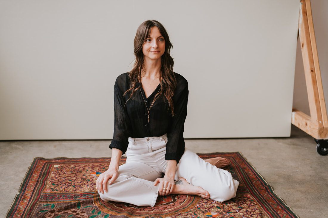 A relaxed studio portrait of Celeste for her spiritual coaching brand photos.