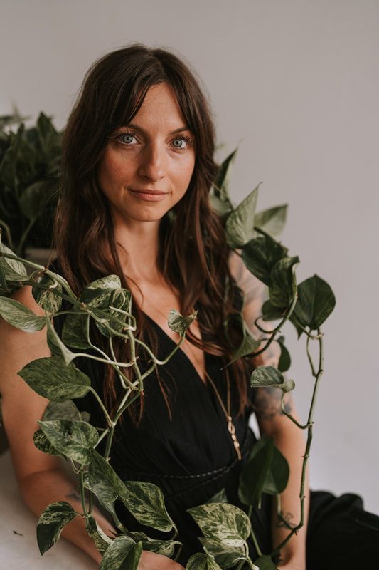 A relaxed studio portrait of Celeste for her spiritual coaching brand photos.