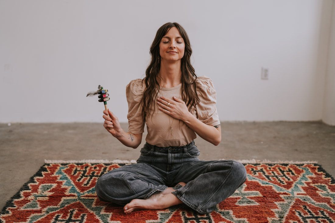 Celeste, a Seattle spiritual plant guide and coach, poses for branding photos in a Chinatown studio.
