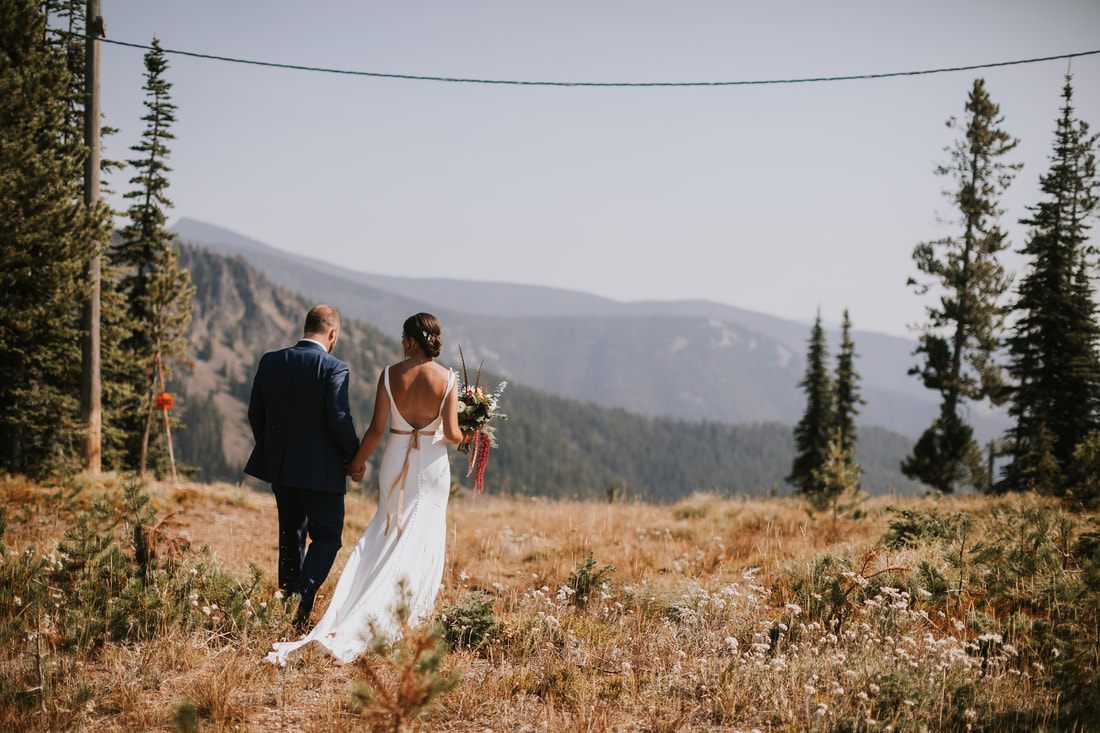 Guests celebrating during a summer wedding reception at Snowbowl