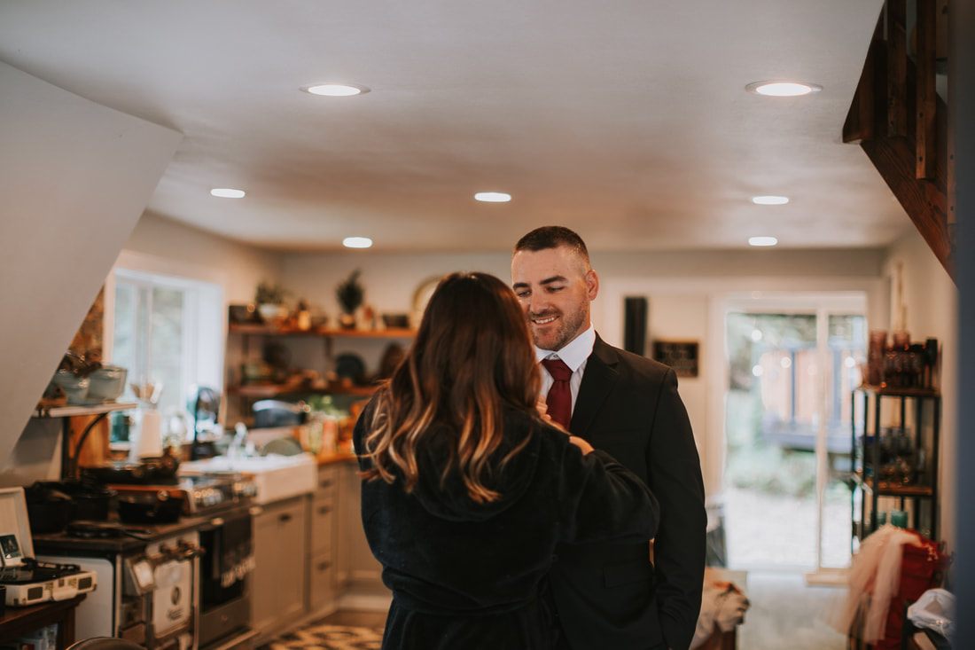 The couple reading personal vows to each other during their intimate ceremony