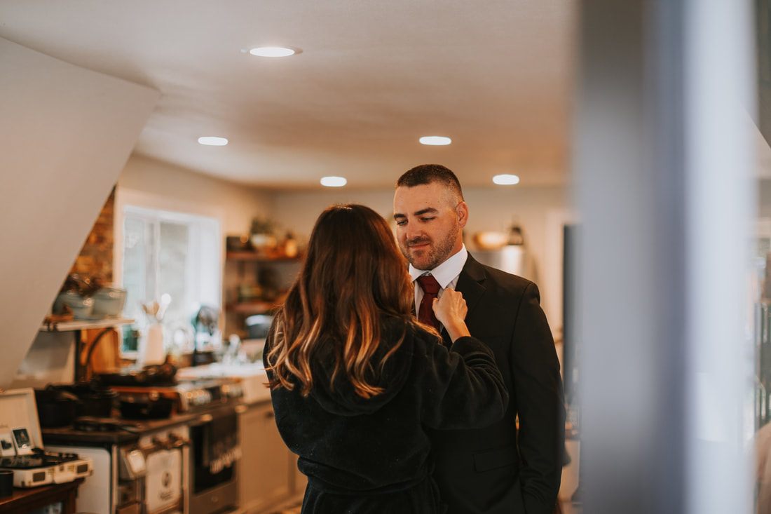 Close-up of the ring exchange during Krystal and Jeremy's elopement ceremony