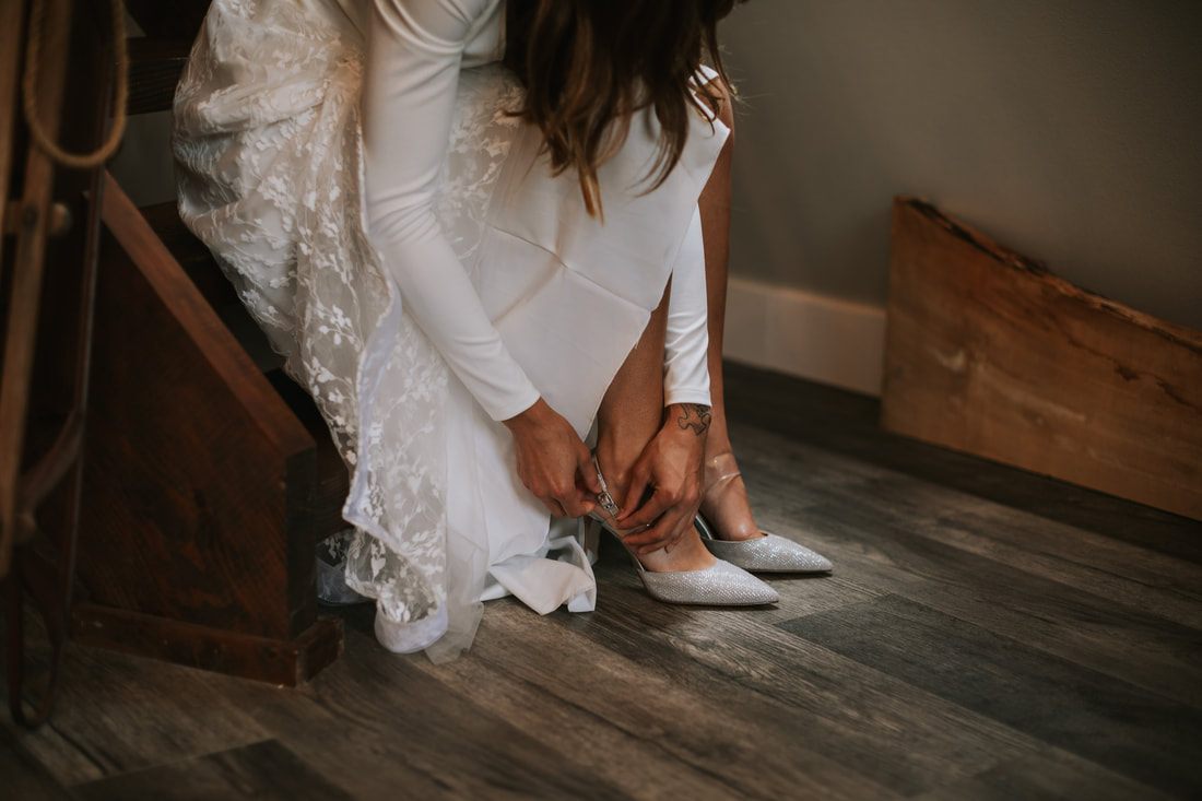 Newlyweds embracing in the forest surrounding the PNW cabin
