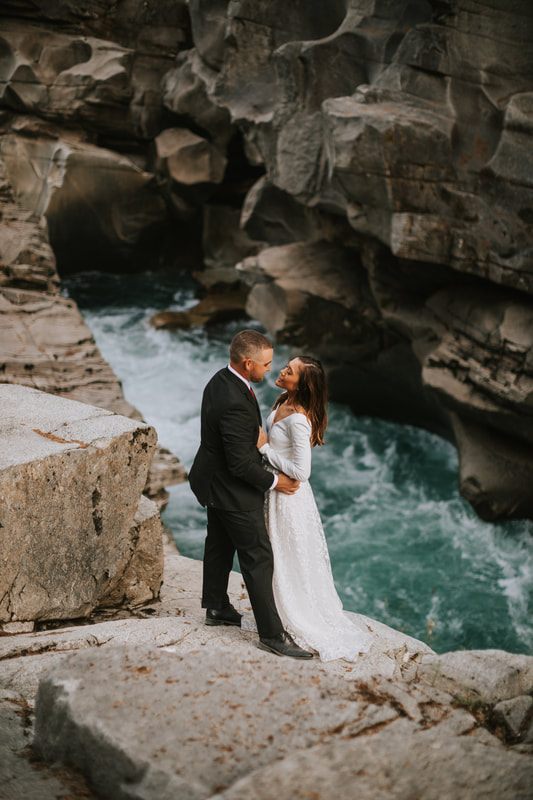 Krystal and Jeremy laughing together in the last light of their elopement day
