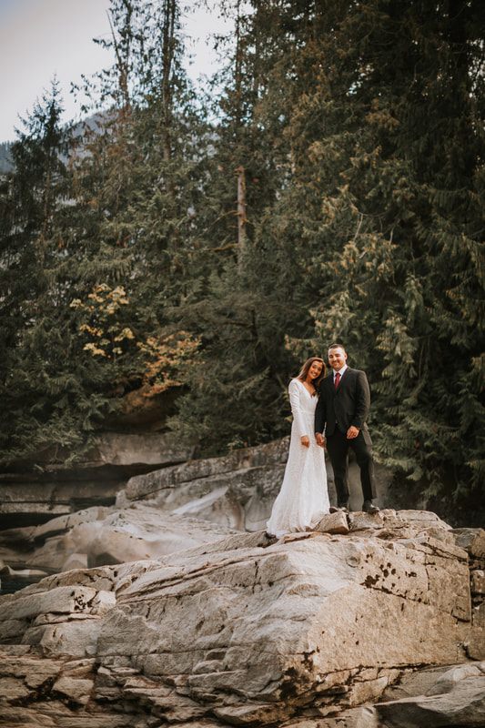 Close-up portrait of the couple wrapped in each other's arms at twilight