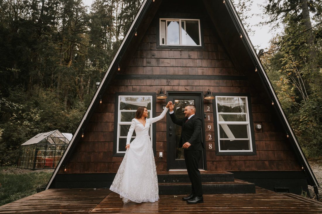 Jeremy helping Krystal cast a fishing line during their elopement day
