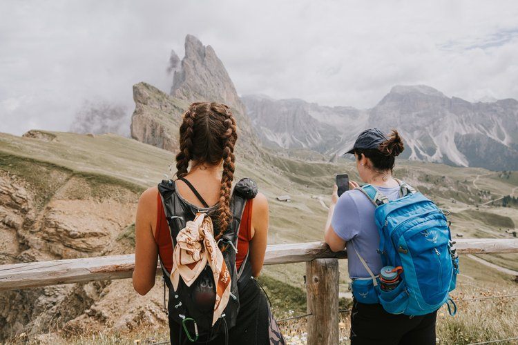 Jagged Dolomites peaks above a green valley
