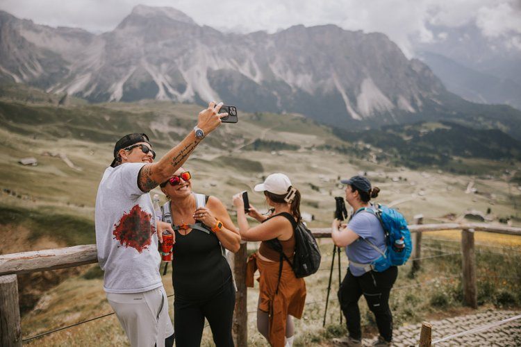 Women hiking a trail in the Italian Alps