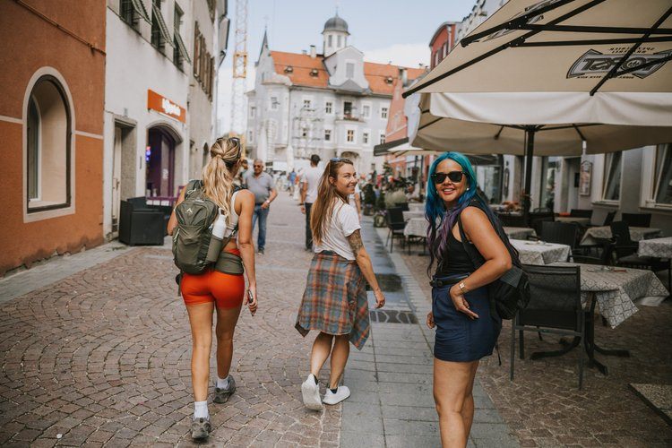 Women hiking a trail in the Italian Alps
