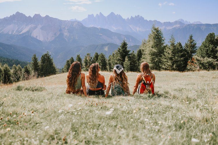 Group of women resting at a Dolomites hiking hut