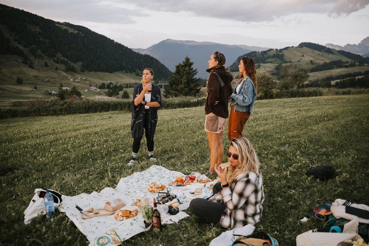 Women hiking a trail in the Italian Alps