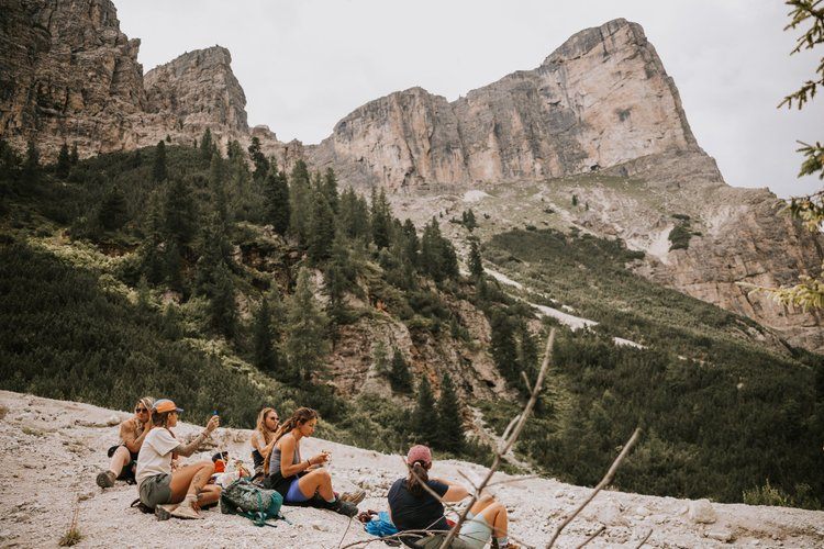 Group of women resting at a Dolomites hiking hut