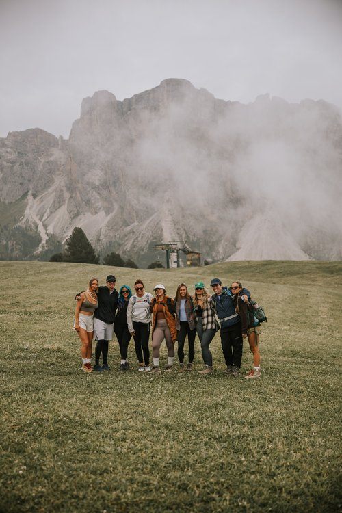 Women hiking a trail in the Italian Alps