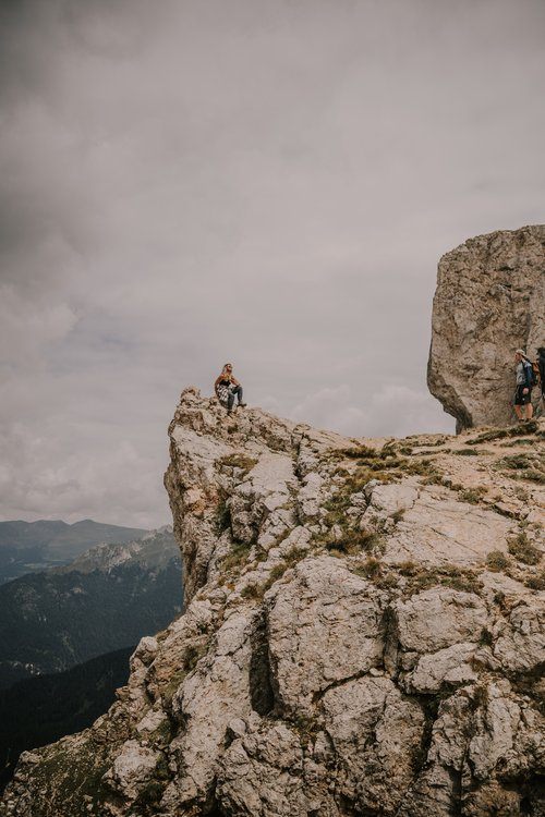 Women hiking a trail in the Italian Alps