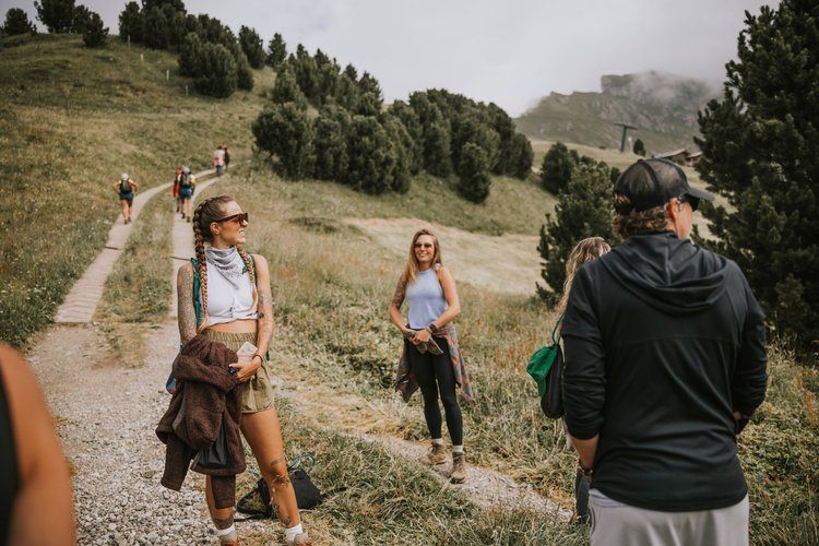 Women hiking a trail in the Italian Alps