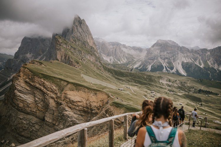 Jagged Dolomites peaks above a green valley