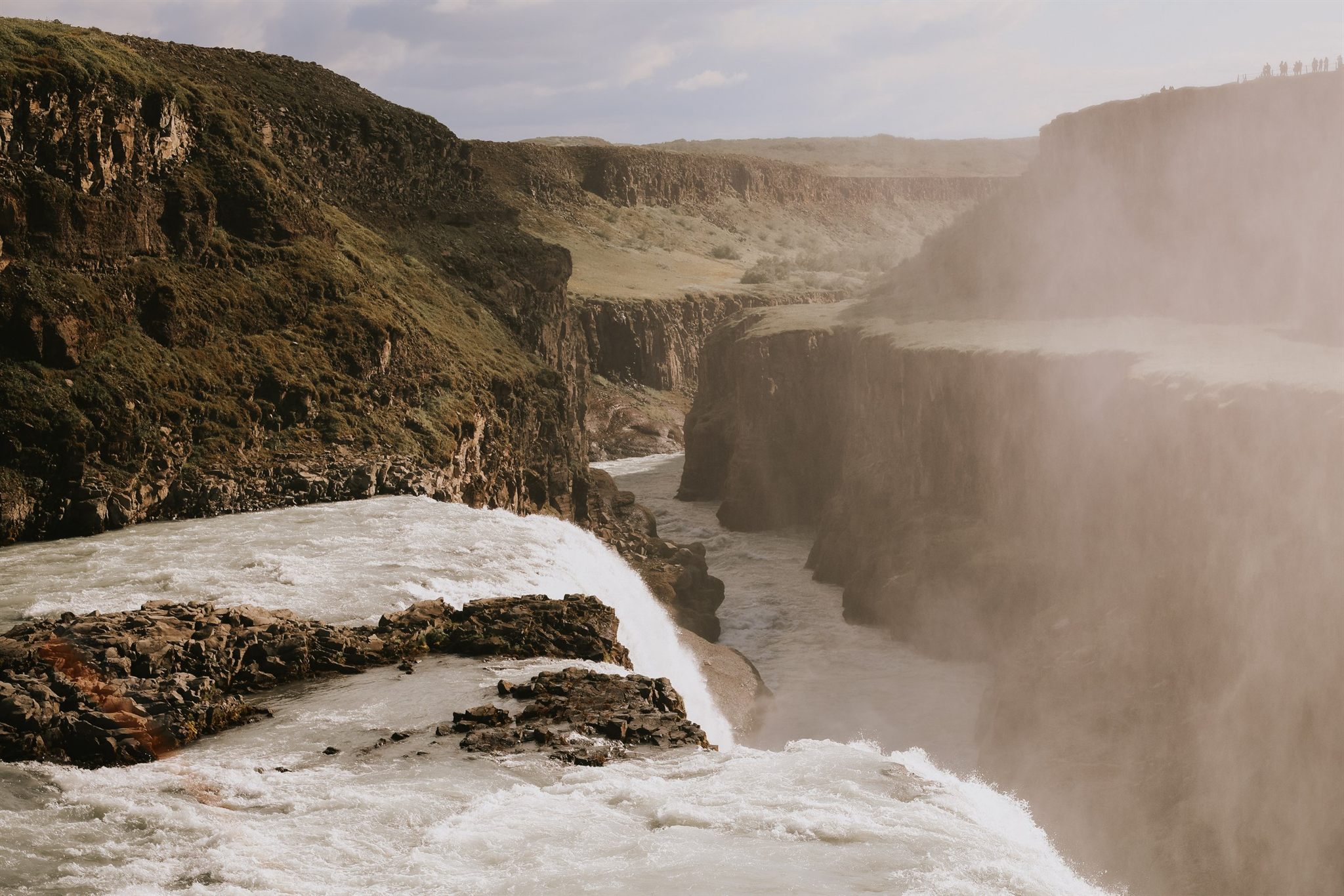 Iceland women's retreat group at a waterfall