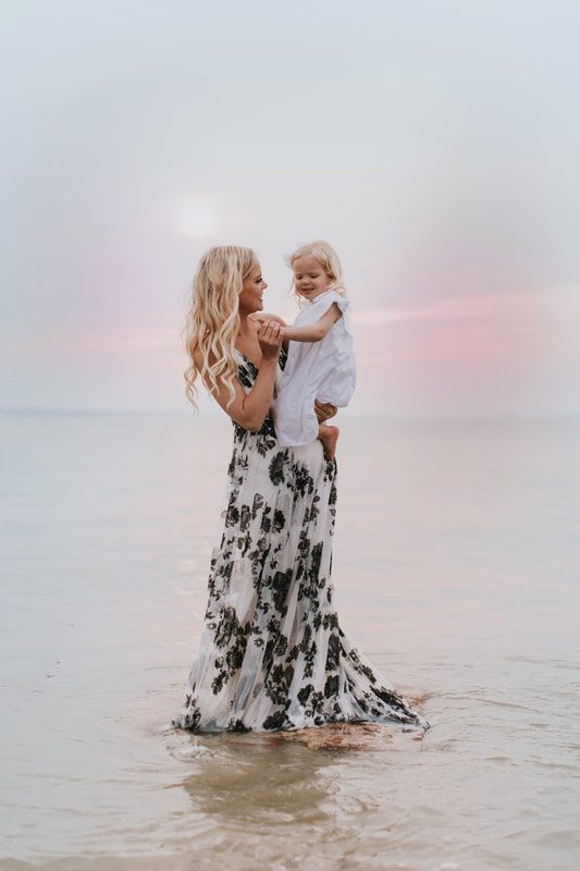 Close-up of Liz holding Aubrey on the beach at Sullivan's Island